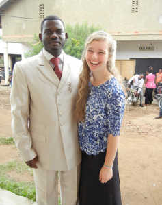 Maddie with pastor James Byensi